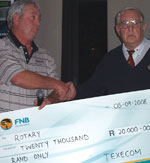Texecom’s John Rodgers on the left handing the cheque to Leon Van Houtte from Rotary